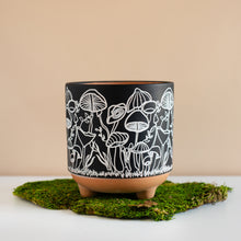 Load image into Gallery viewer, Black and white mushroom motif planter on top of a green moss pad.
